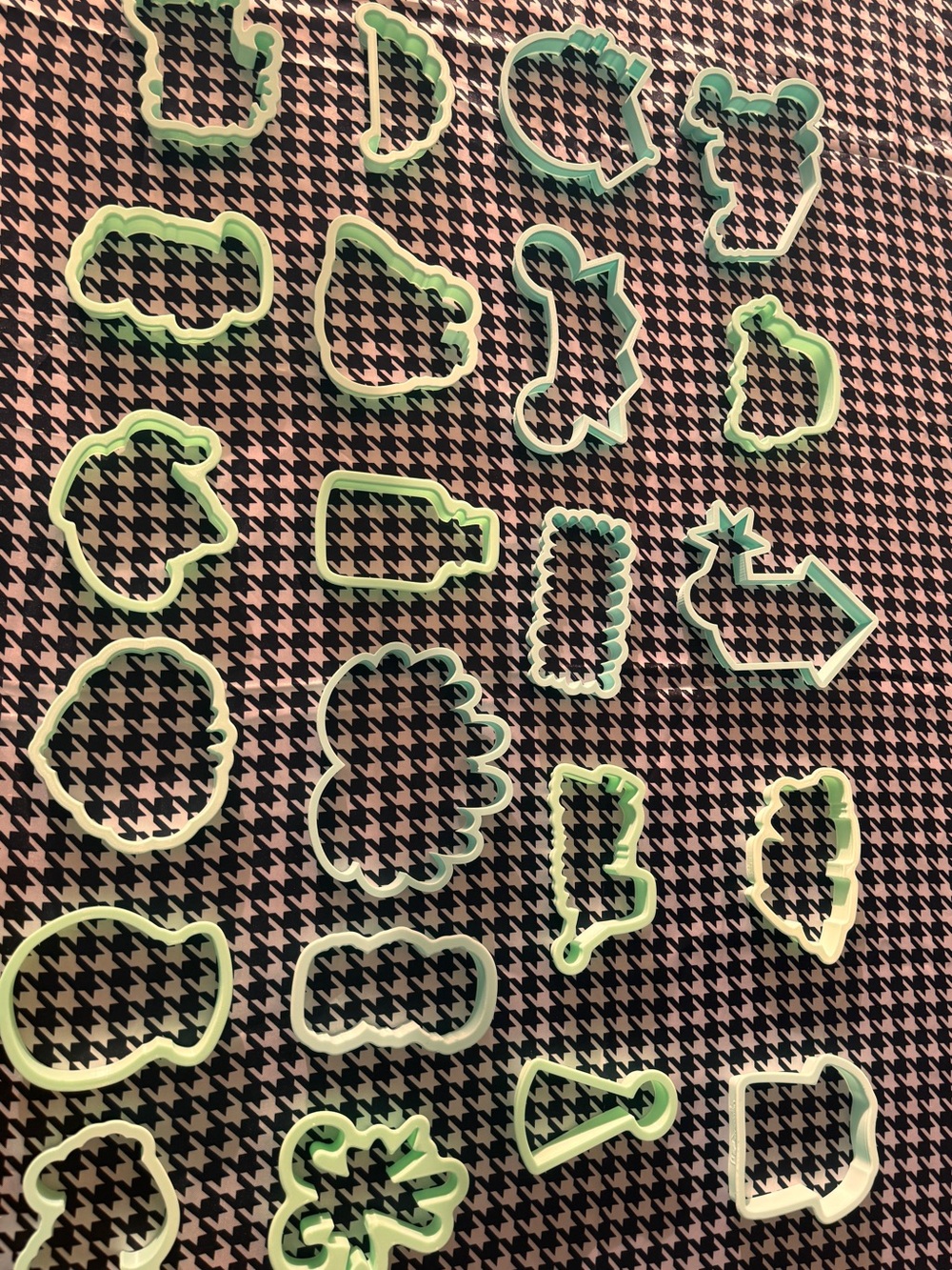 **Title:** 24 Mint Green Cookie Cutters, Full Set